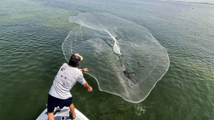 Dropout cast net fully open just before it hits the water