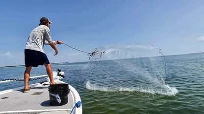 Dropout cast net landing fully open on the water